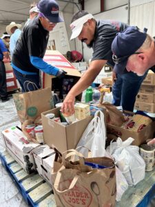 Team Blake's helping box donations with the Albuquerque Isotopes